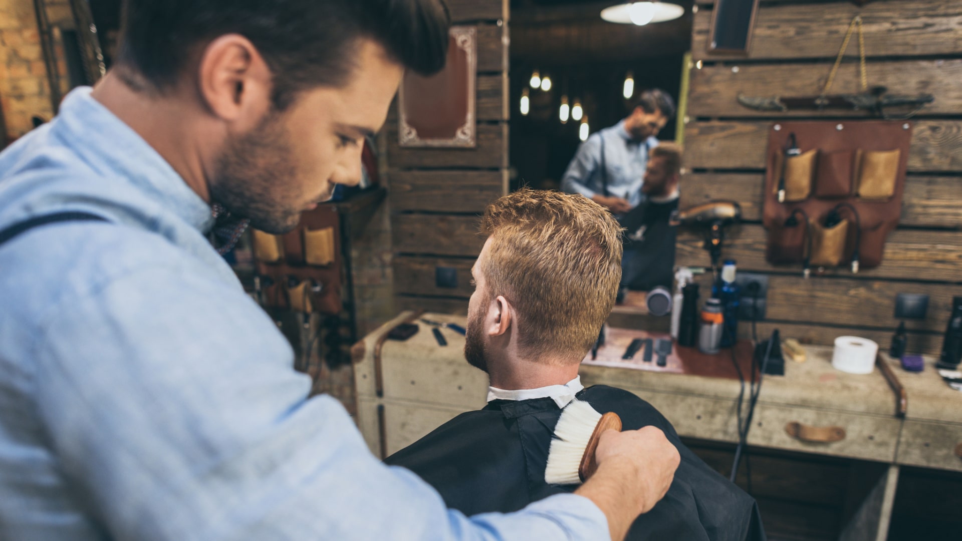 barber finishing a haircut