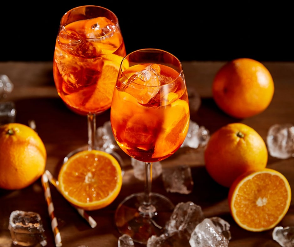 Ice cubes and orange slices in a glass